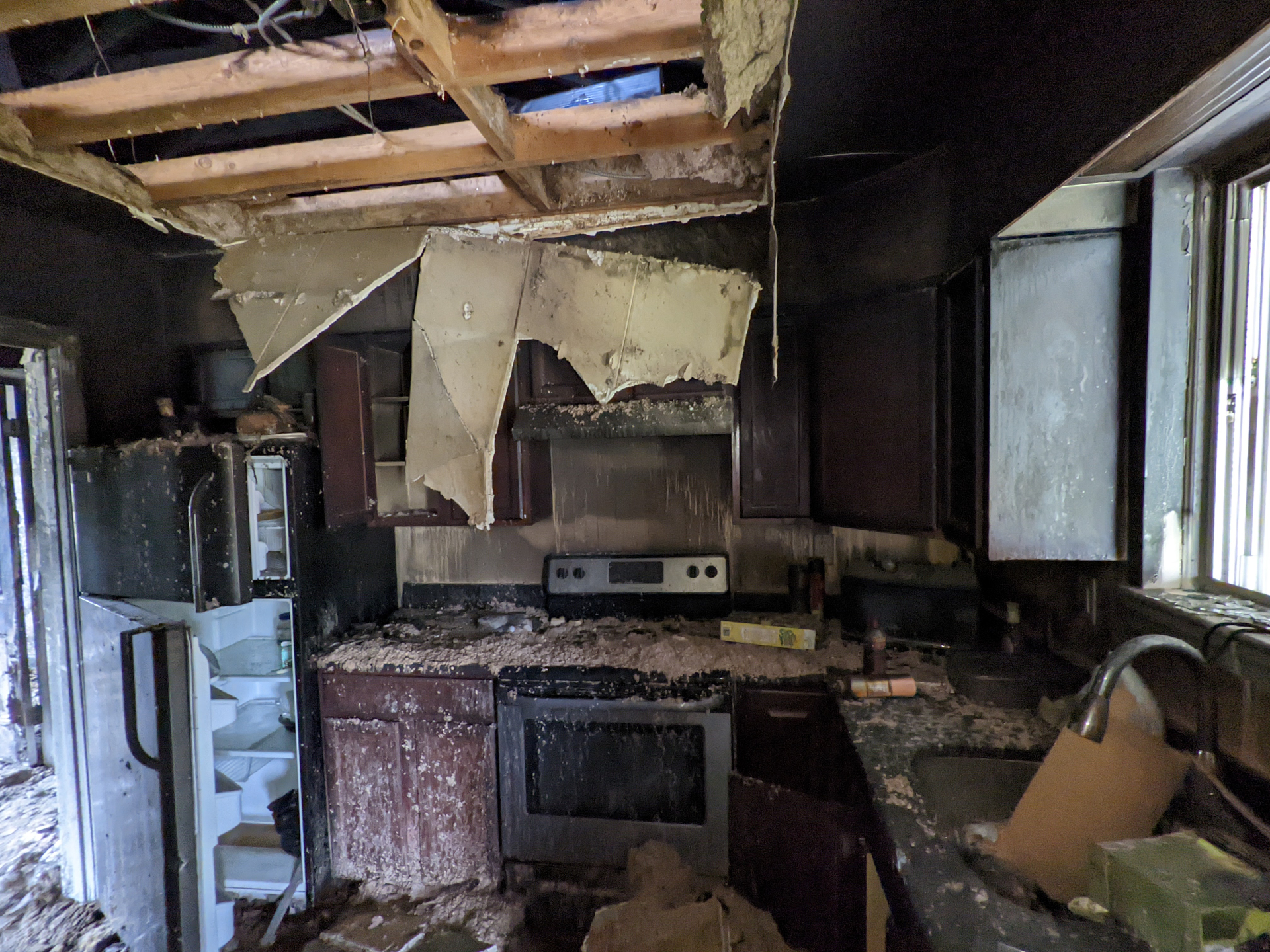 Before renovation – destroyed kitchen, Iron Gate Development flip project DC MD VA