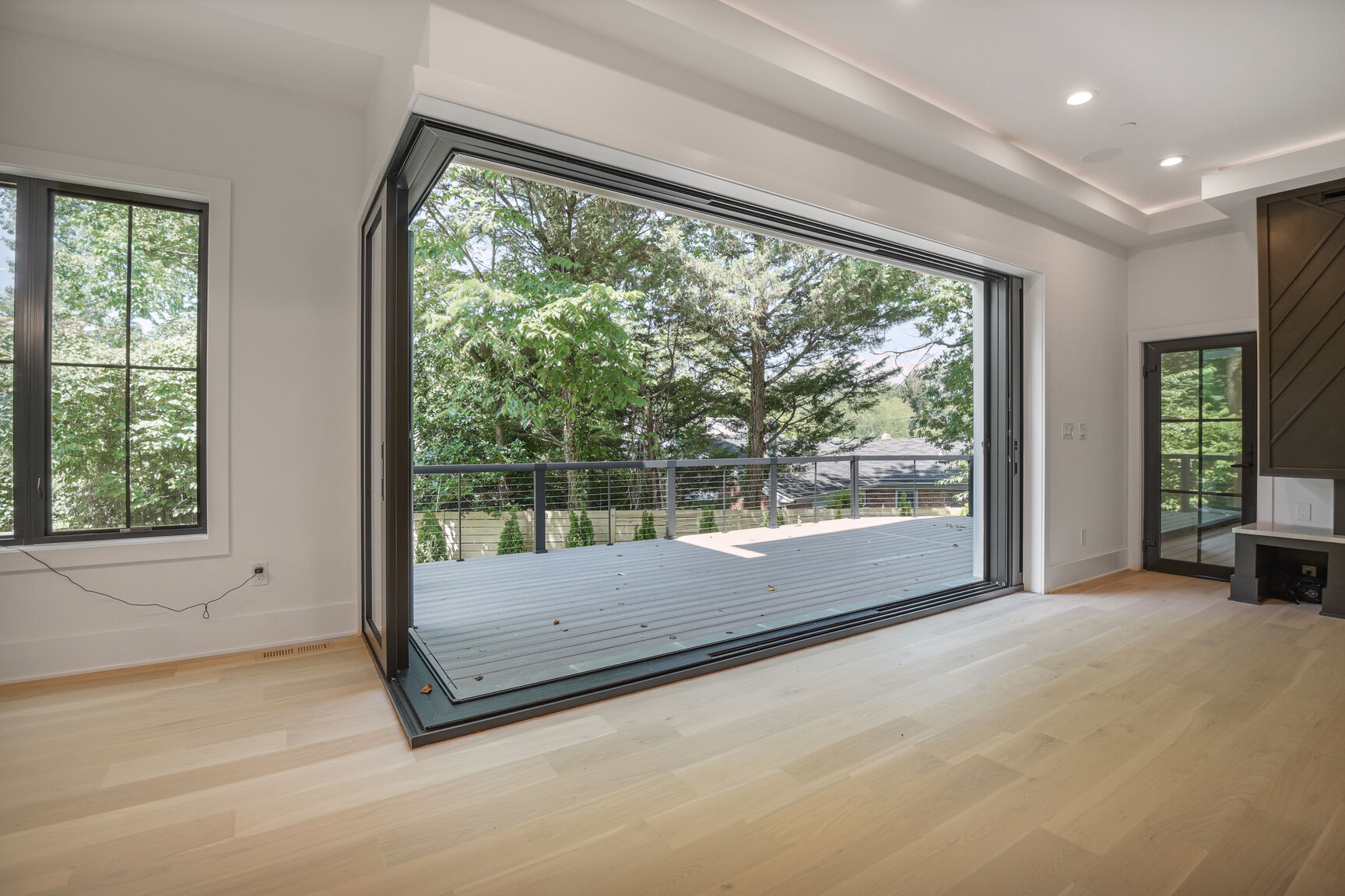 Living room with folding glass doors to deck