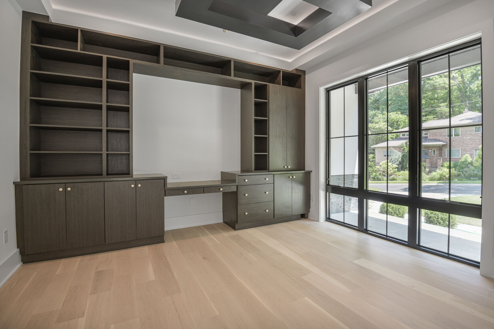 Custom built-in office with dark cabinetry