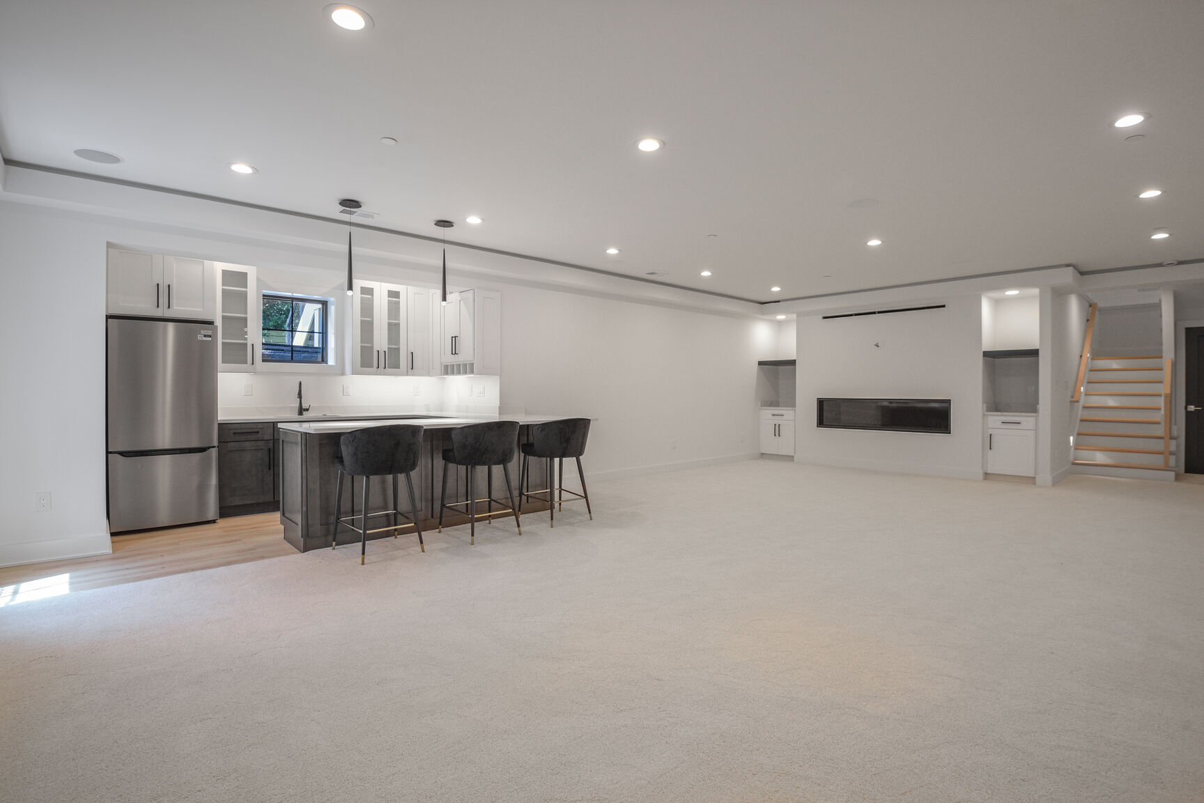 Basement with kitchen and fireplace